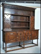Waring and Gillows - A good quality 20th century oak Jacobean revival dresser, the high back with