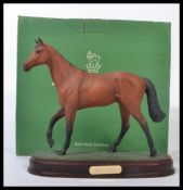A Royal Doulton model of Red Rum on wood plinth DA226 (boxed) Measures 22cms high. Appears in good