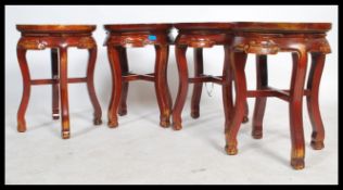 A set of four 20th century Chinese oriental stools