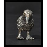 A sterling silver figurine of a water bird with stone eyes. Weighs 10.5 grams.