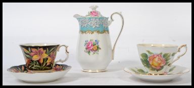 A 20th century bone China Royal Albert coffee / water pot in the Enchantment pattern together with a