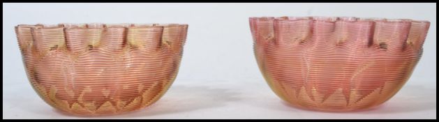 A pair of 19th century Victorian banded / ribbed carnival glass bowls having a scalloped edge with