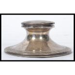 A silver hallmarked Capstan inkwell by Walker & Hall with sheffield hallmarks, date letter