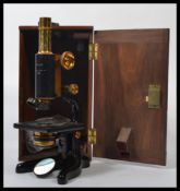 A vintage early 20th century cased W. Watson & Sons Ltd " Service " microscope No 25694 with extra