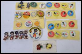 A collection of vintage and retro advertising pin badges to include Robinsons Gollie badges both