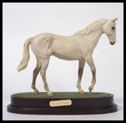 A Royal Doulton Connoisseur model of Desert Orchid (DA134), height 22.5cm appears in good order with