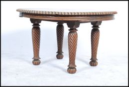 A 19th century mahogany centre table - coffee table of circular form with fitted frieze being raised