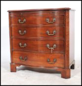 A 20th century bow fronted entertainment cabinet in the form of a Georgian bow front chest of