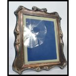 A large 20th century Vogel of London silver plated easel mirror in the Adams revival style marked