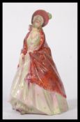 An early Royal Doulton porcelain figurine entitled ' The Paisley Shawl ' RD No 753120 / HN1392.