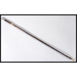 A vintage early 20th century walking stick cane having a tapering wooden shaft with brass collar and
