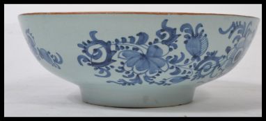 An 18th century English Delft pottery footed bowl having geometric borders with central cartouche