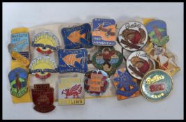 A collection of vintage enamel badges all pertaining to Butlins to include a rare 1957 Margate