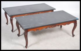 A pair of contemporary upcycled Industrial style coffee tables having large black slate table tops