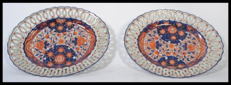 A pair of late Meiji period Oriental Japanese Imari ribbon platter plates hand painted and decorated