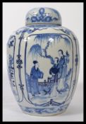 A large 19th century blue and white Chinese ginger jar with hand painted cartouche panels