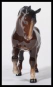 A vintage Beswick made ceramic china small horse. Beswick makers marks to base. Mottled brown in