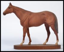 A Beswick connoisseur model Grundy racehorse of the year 1975, matt chestnut on wooden plinth. In