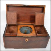 A 19th century flame mahogany and rose wood cross banded tea caddy having a hinged lid opening to re