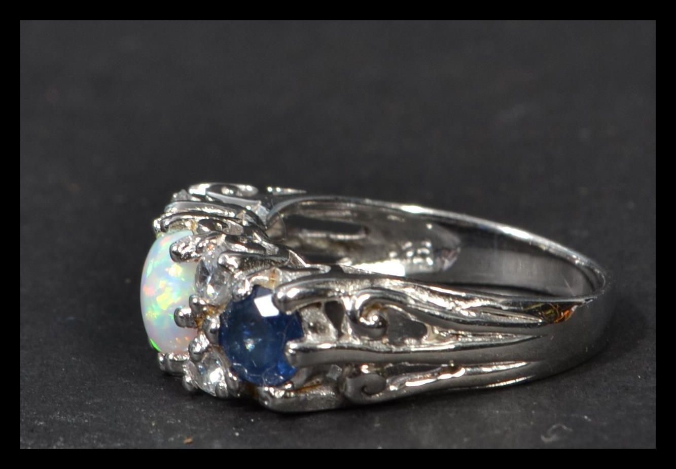 A sterling silver cz sapphire and opal dress ring. Weighs 5 grams. - Image 5 of 5