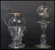 A 19th century Victorian glass lace makers lamp along with a Victorian honey dispenser and stand