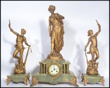 A 19th century clock and garniture set raised on g