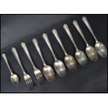 A set of six silver dessert spoons ( tested ) together with two matching forks. All marked silver.