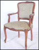 A 20th century French fauteuil beech wood armchair