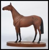 A group of Royal Doulton and Beswick figures of horses to include Red Rum, DA 226 style III, on