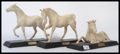 A group of three Beswick ceramic figurines of horses in plain white glaze to include Spirit of Peace