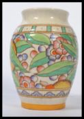 A Charlotte Rhead Bursley Ware vase decorated with band of fruit and flowers and geometric borders