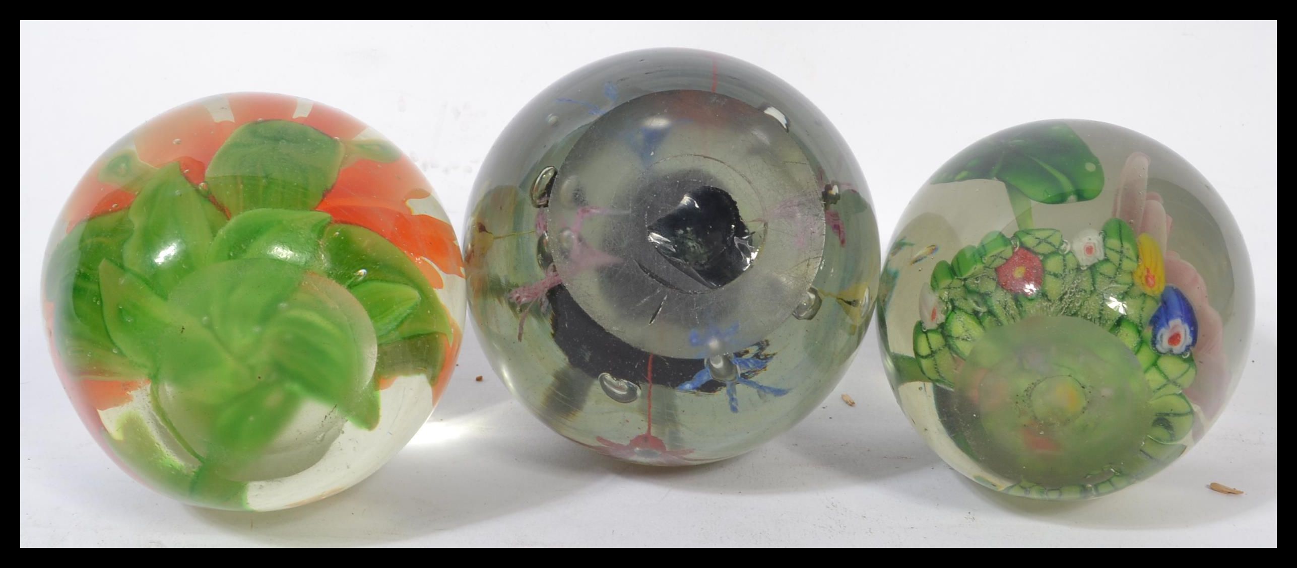 A group of three Nailsea glass 19th century Victorian paperweight glass dumps having inset floral - Image 6 of 6