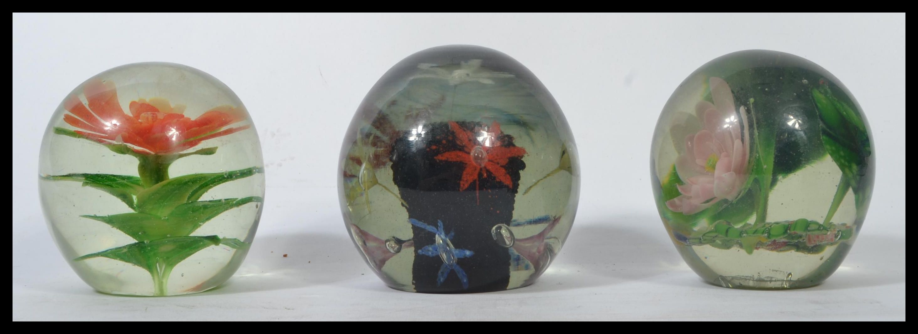 A group of three Nailsea glass 19th century Victorian paperweight glass dumps having inset floral - Image 2 of 6