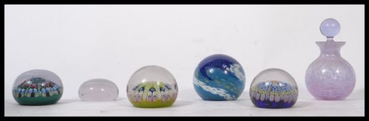 A collection of vintage 20th century studio art glass paperweights to include millefiori cane