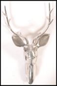 An interesting believed Scandinavian 20th century  large polished steel cast sculpture of a stags