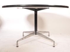 A 1980's, circa 1985 Charles and Ray Eames for Vitra circular chrome and laminate table raised on