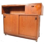A good 1970's retro teak wood cocktail / drinks bar. Having an unusual stepped panel front with