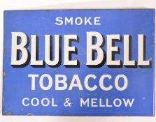 An early 20th century Industrial Blue Bell Tobacco ' Cool & Mellow ' double sided enamel sign with