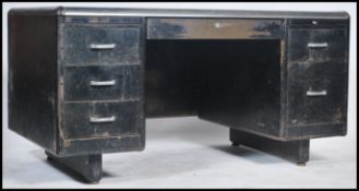 An original circa 1940's Industrial metal desk of ebonised form being raised on suspended