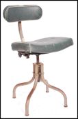 A mid century Industrial Tansad office chair of tubular metal construction having a swivel seat