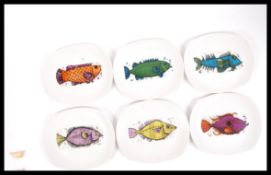 A set of vintage Washington pottery ' Aquarius ' fish plates having vibrant colours with makers