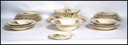 A stunning vintage part dinner service by Alfred Meakin in ' The Fair Ground ' pattern, consisting