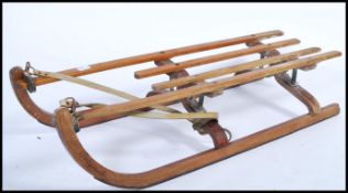 A vintage 20th century ashwood and plywood sleigh - sledge by Polycomb. The sleigh of bentwood