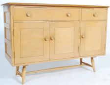 A mid century 1950s light Ercol Sideboard  with elm plank top above beech front with drawers over