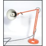 A retro 20th century Herbert Terry anglepoise industrial desk lamp with conical shade raised on a