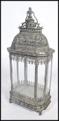 An unusual 20th century large aged metal Indian porch lantern for candles. Intricate pierced frame