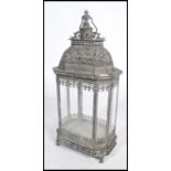 An unusual 20th century large aged metal Indian porch lantern for candles. Intricate pierced frame