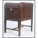 An unusual early 20th century   Industrial pedestal  tambour top tall   filing cabinet./