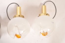 A pair of vintage retro 20th century Mazzega Murano flower pendant ceiling lights. The white bowls