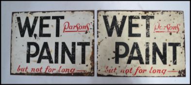 A pair of vintage early 20th century Industrial ' Wet Paint - But Not For Long- ' enamel signs.